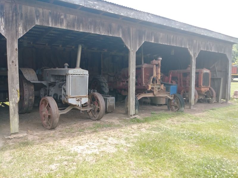 Old Tractors And Farm Equipment On Display