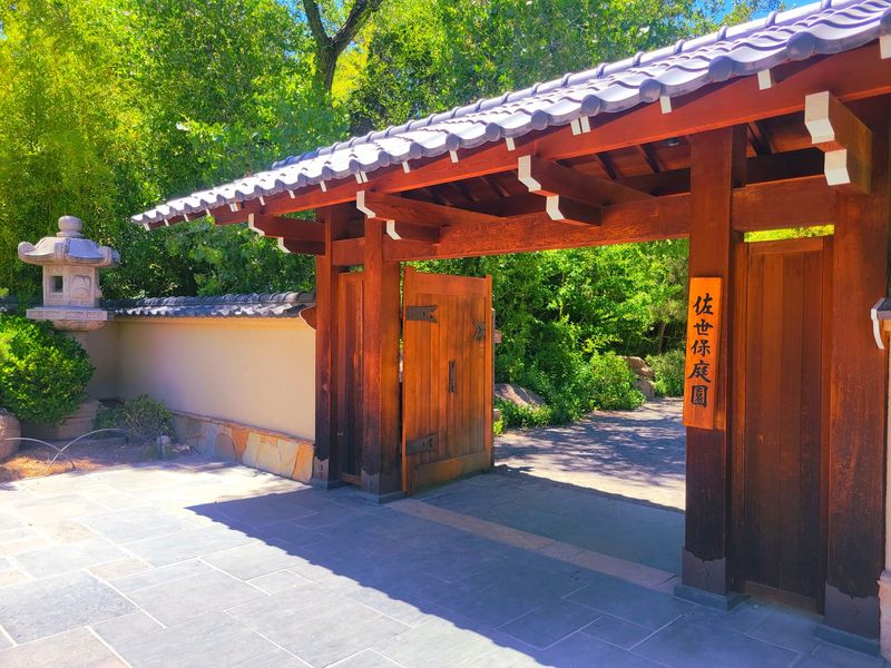 Wooden Gates and the Bell Tower Welcome