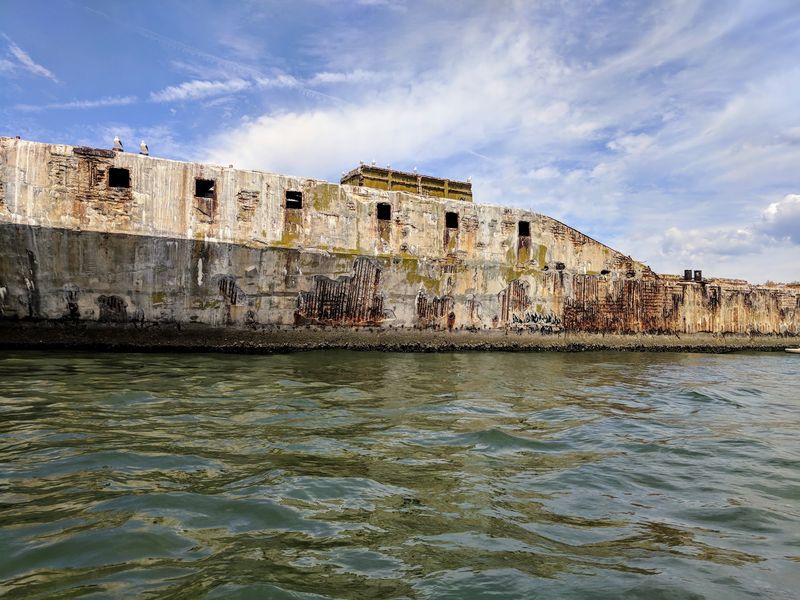 Nine Concrete Ships Sit Just Offshore
