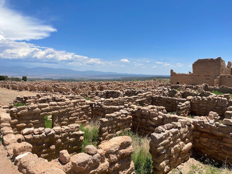 A Historic Kiva Sits Above The Cliffs