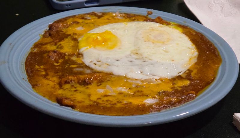 Enchiladas Con Huevo Topped With A Fried Egg