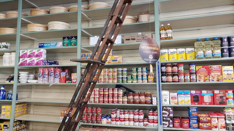 Original Shelves And Track Ladders Still Line The Interior