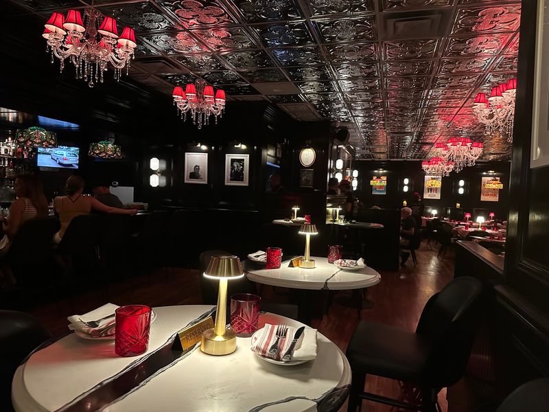 Dark Wood And Chandeliers Set The Jupiter Scene