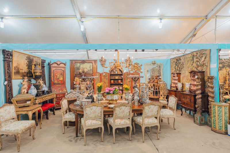 Quilts, Paintings, And Furniture Compete For Your Attention