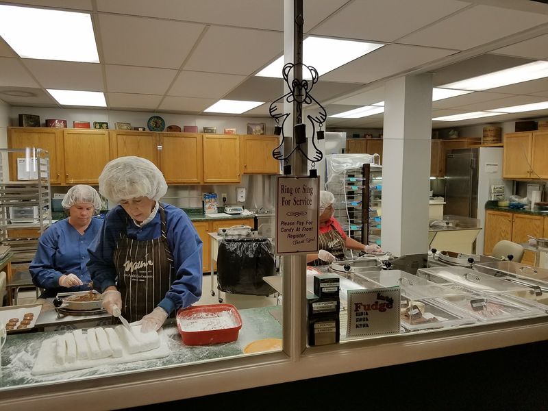 Candy Makers at Work Behind the Glass