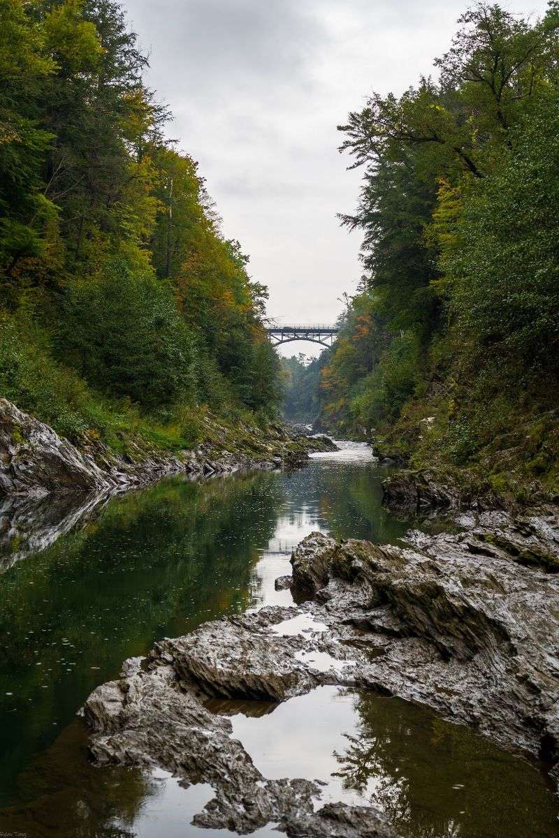 The Historic Bridge Rises High Above The Gorge