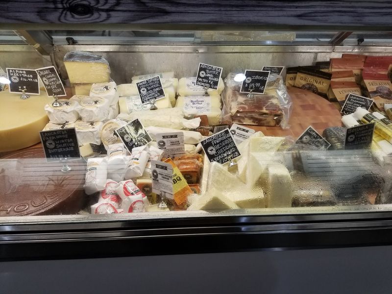 Smoked Hams, Cheeses, And Turkeys Fill The Meat Counters