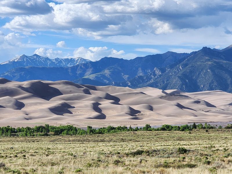 Mountains And Dunes Share The Same Horizon