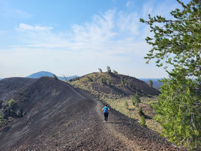 Climb A Dark Cinder Cone For Views That Feel Borrowed From Another Planet