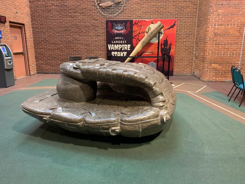 A Stone Glove Outside Lets Kids Climb, Crawl, And Slide