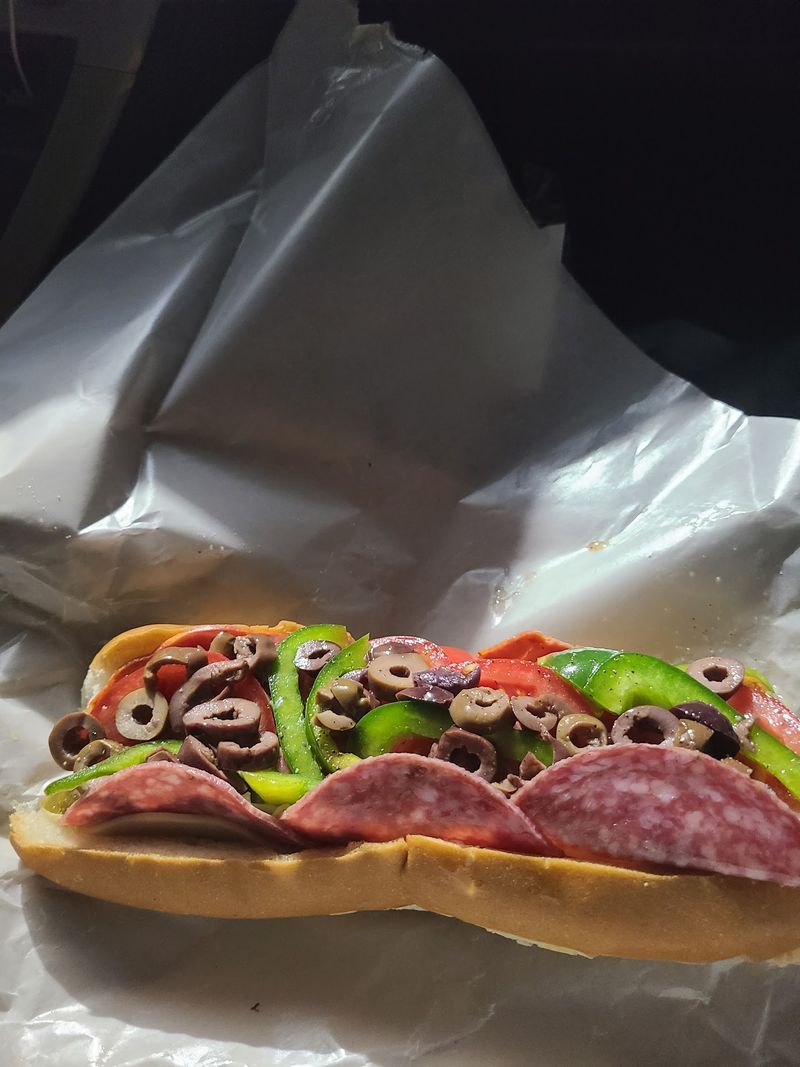 Ham, Fresh Vegetables, And Greek Olives Give The Original Italian Its Signature Flavor