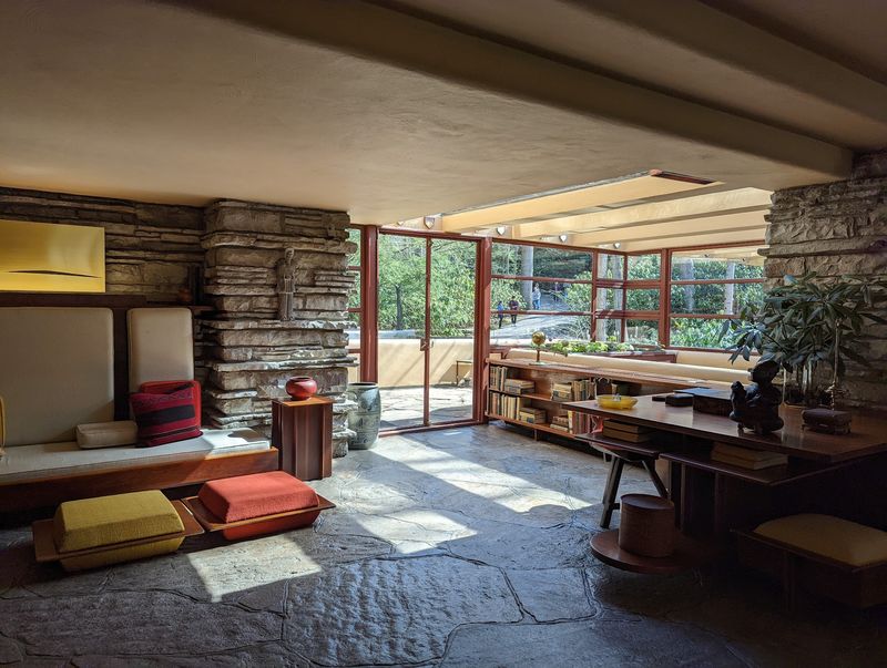 Inside The Stone Walls And Open Living Spaces Of America's Famous Waterfall House