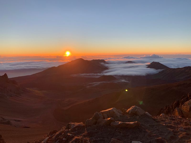Sunrise Above The Clouds Paints The Crater In Brilliant Orange And Gold