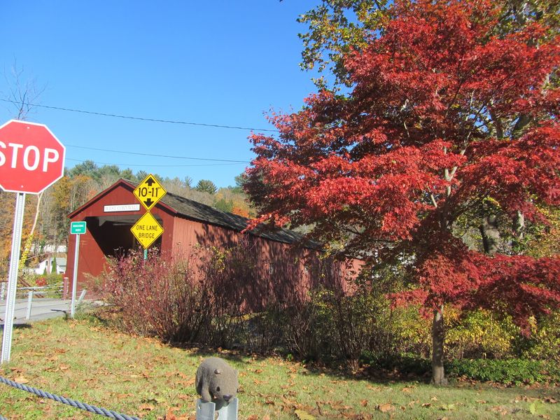 A Red Bridge That Has Outlasted Floods, Ice, And Over 150 Years