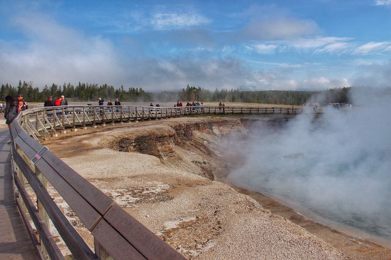 The Midway Geyser Basin Boardwalk Brings Visitors Close To The Rainbow Waters