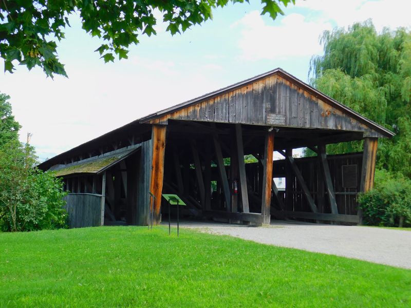 Walk Across A Covered Bridge That Used To Carry Two Lanes