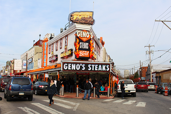 Geno's definitely has the flashier facade. (Photo: Paul Stafford)