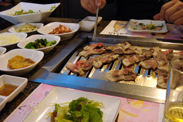 Beef cooking at Soowon Galbi (Photo: Melissa via Flickr)