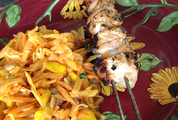 Skewered seafood, freshly caught and grilled, served with mango salad (Photo: Dan Ayres)