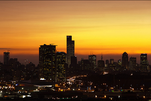 Tel Aviv's skyline at dusk (Photo: Yevgeniy Shpika via Flickr)